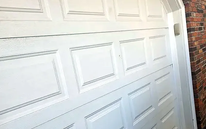Close-up of white raised garage door panels